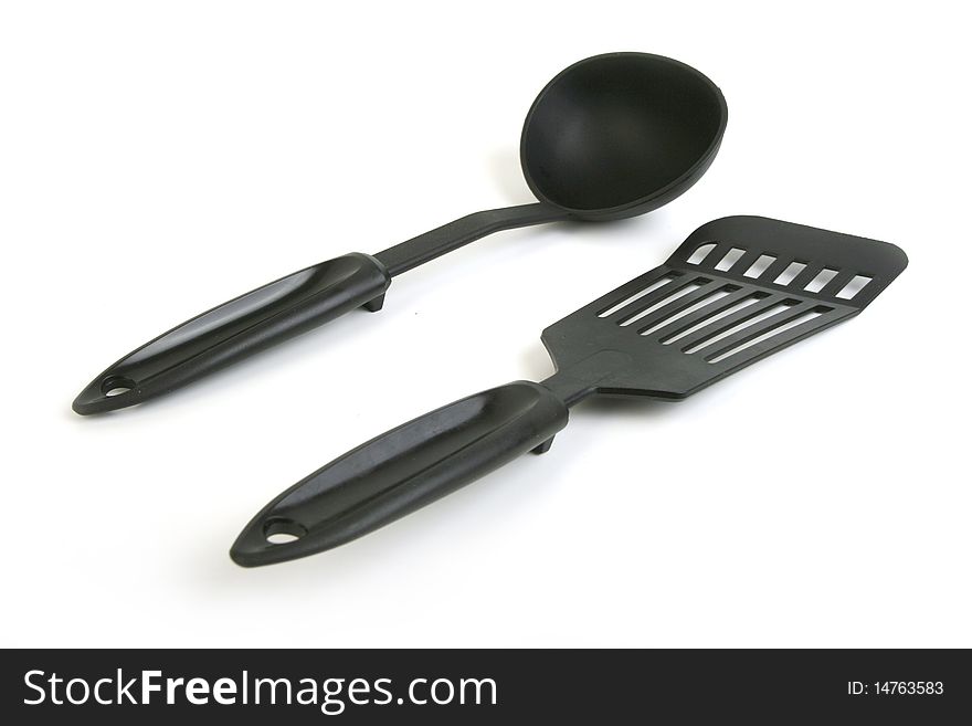 Plastic soup ladle and scoop on white background