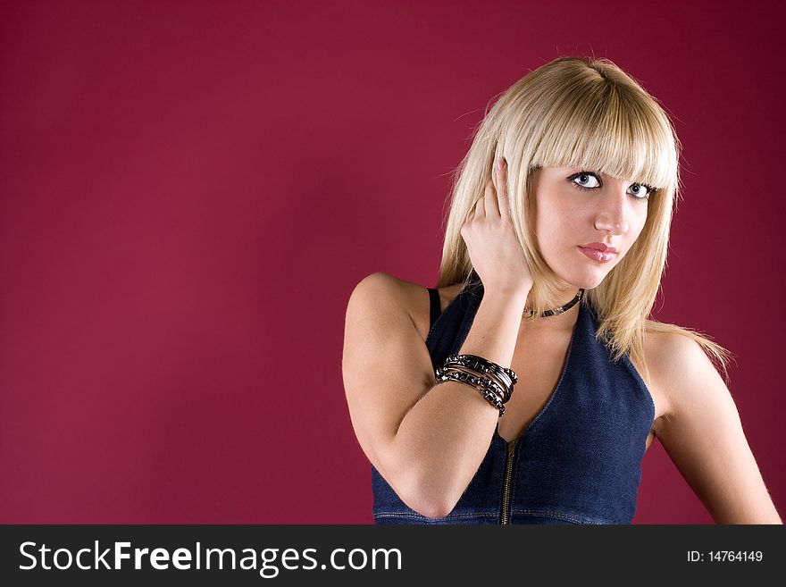 Image of friendly blond over red background. Image of friendly blond over red background