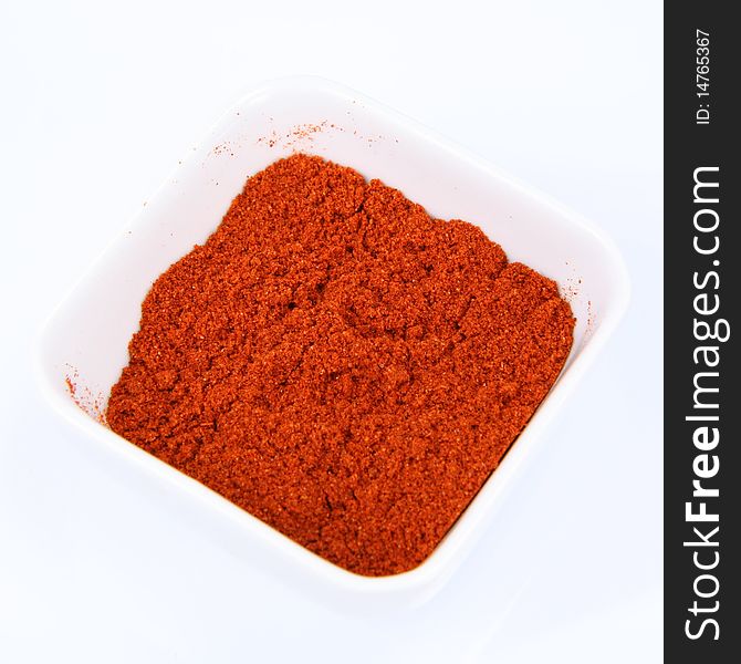 Paprika in a small white bowl