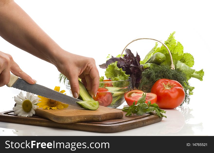 Cutting vegetables for salad preparing