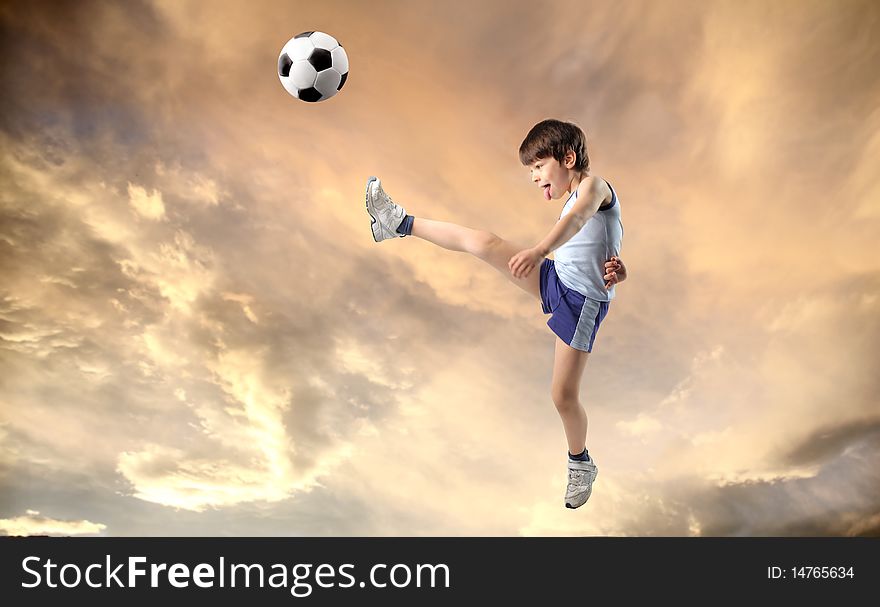 Child shooting a foot ball. Child shooting a foot ball
