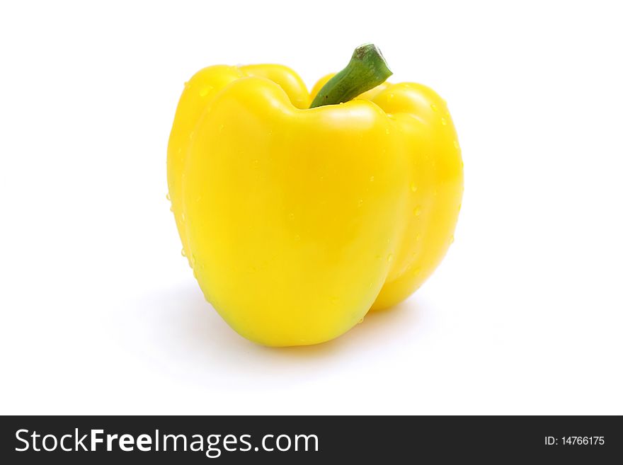 Close up of a yellow pepper isolated on white background.
