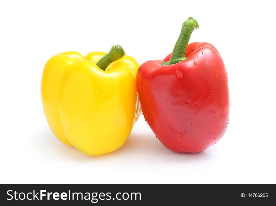 Close up of yellow and red pepper isolated on white background. Close up of yellow and red pepper isolated on white background.