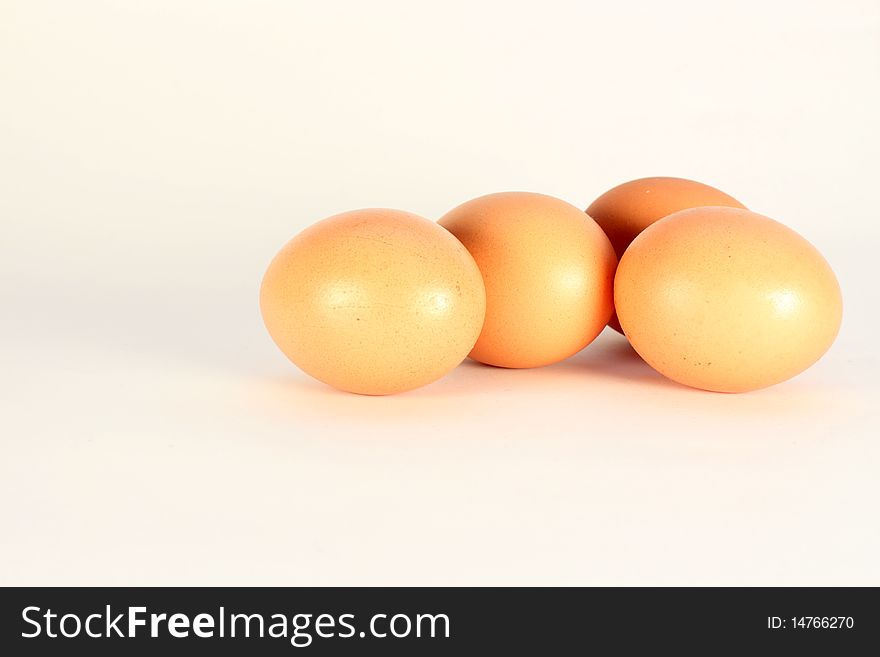 Four brown eggs isolated on a white background. Four brown eggs isolated on a white background