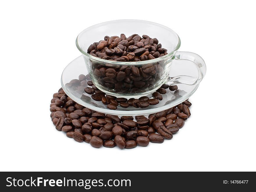 Coffee beans in a cup and on the plate, white background isolated. Coffee beans in a cup and on the plate, white background isolated