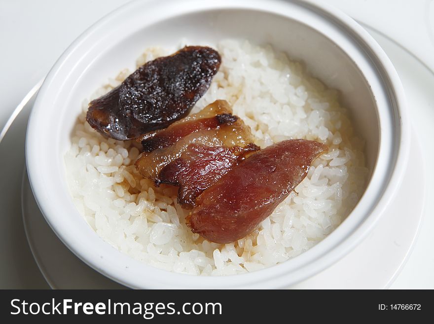 Chinese food, rice with sausage in the bowl.