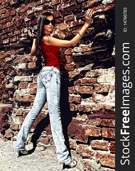 Unforgettable Model Standing Near Old Wall.