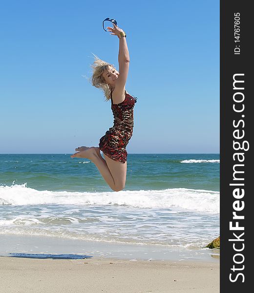 Young Blonde Woman Vacationing At The Beach