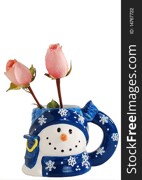 Two beautiful pink rose in lovely snowmen shape mug isolated on a white background. Two beautiful pink rose in lovely snowmen shape mug isolated on a white background.