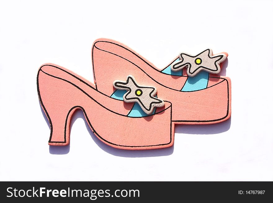 Miniature model of a pair of princess shoes. shoe shopping concept.