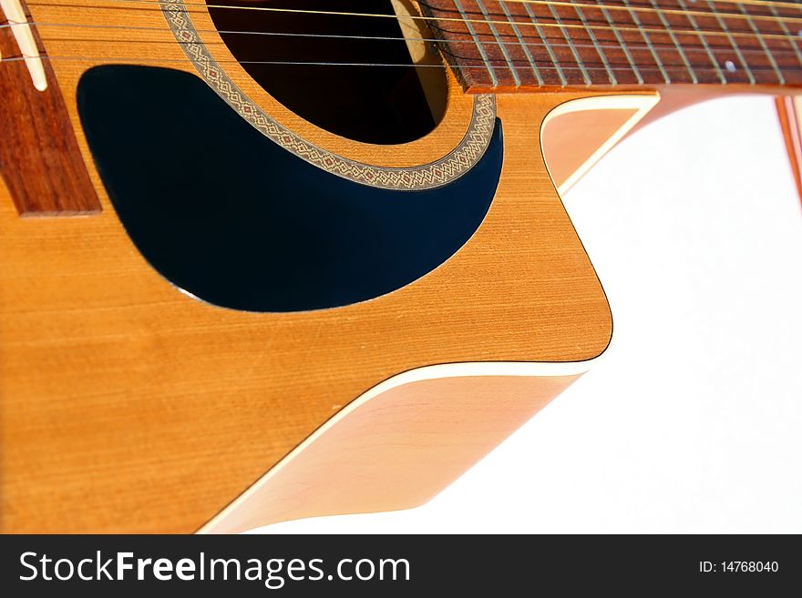 Closeup of a guitar on white background. Closeup of a guitar on white background