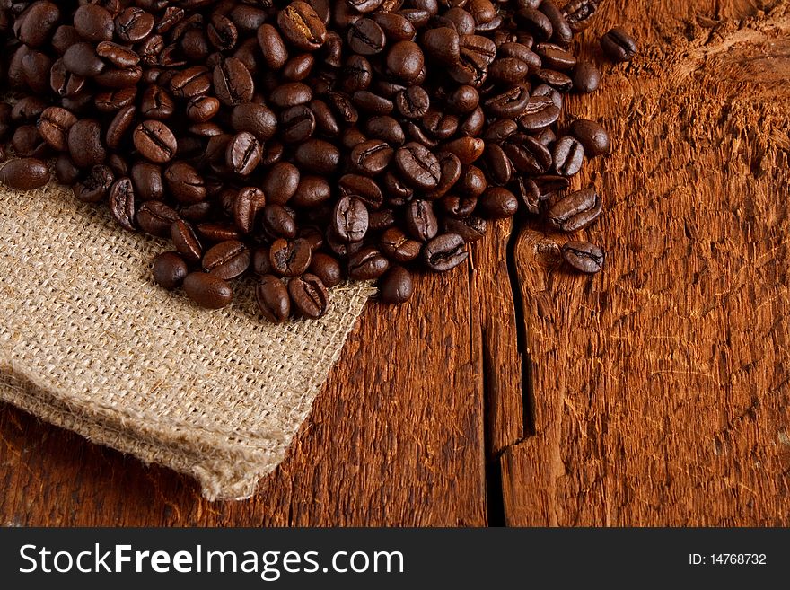 Roasted coffee beans on wood