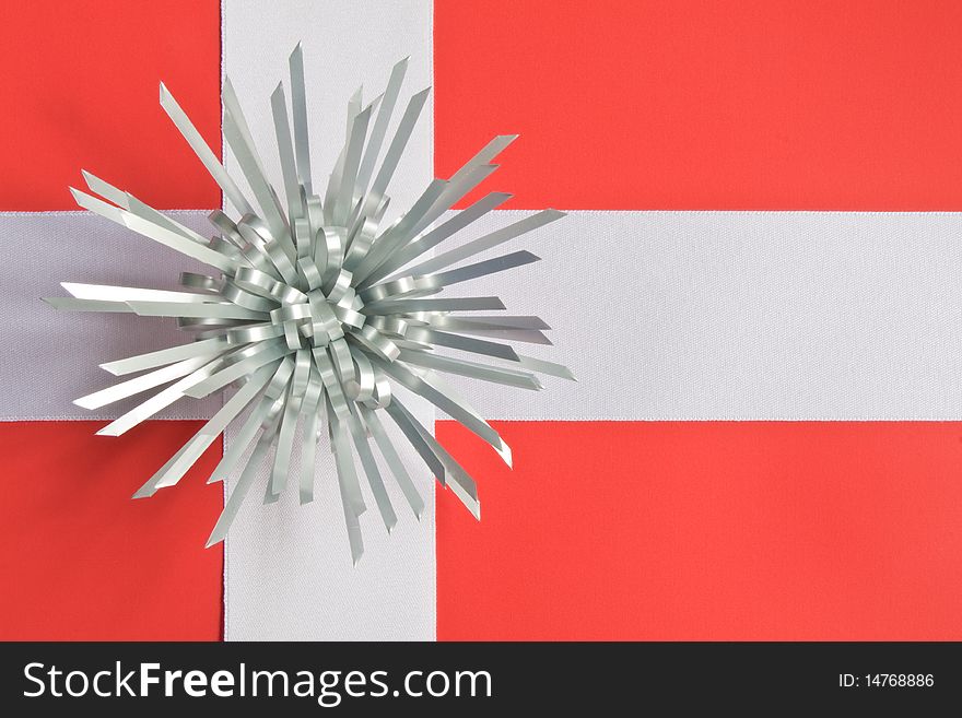 A gift tied with ribbon representing Denmark's flag. A gift tied with ribbon representing Denmark's flag