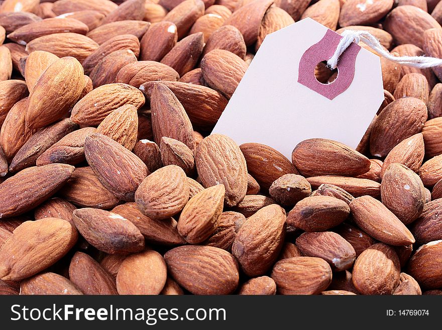 Crop of almond nuts with a label for placing of the necessary information.