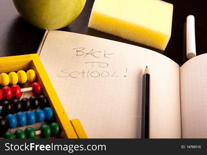 Education concept, black board, chalk and notebooks. Back to school!