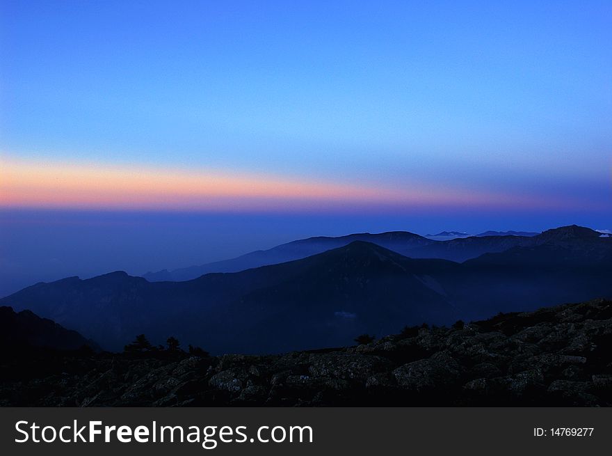 Scenery of sunset at dusk in the mountains