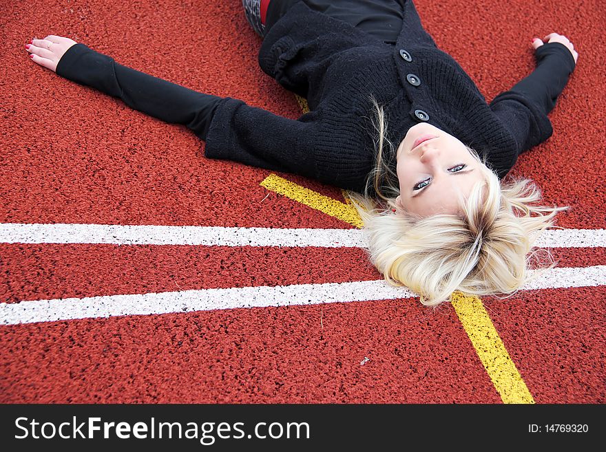 Girl lying on a track