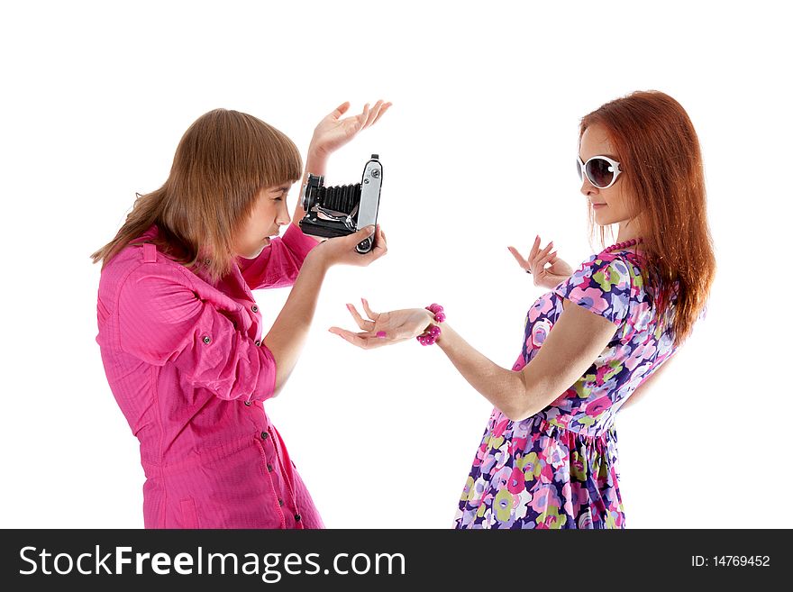 Two girls are taken pictures by analog camera