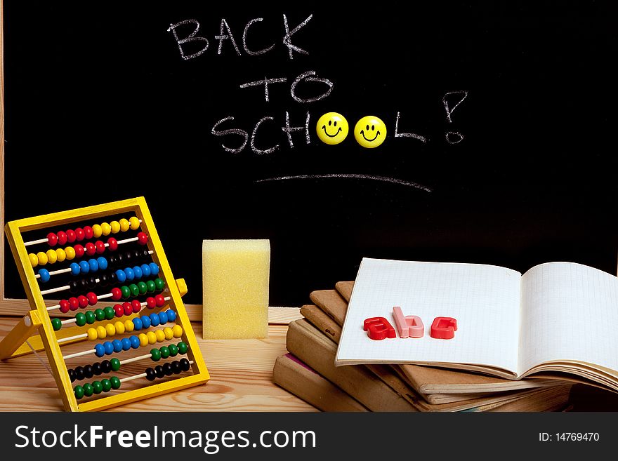 Education concept, black board, chalk and notebooks. Back to school!