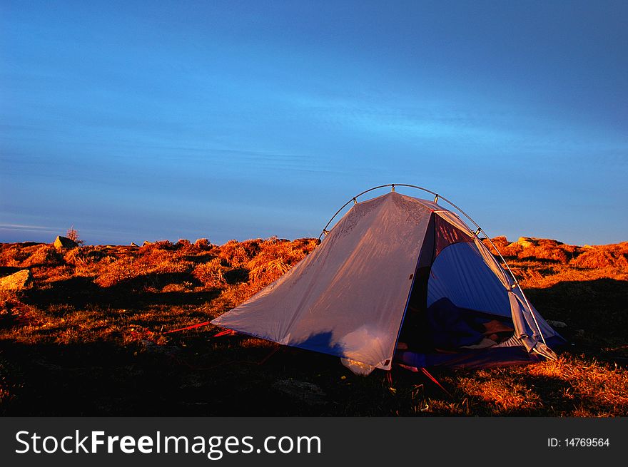 Scenery of camping on the top of the mountains with blue skies as background