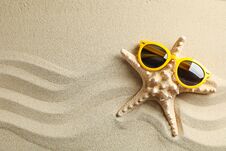 Clear Sea Sand With Starfish And Sunglasses, Space For Text. Summer Vacation Stock Photography