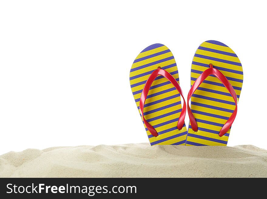 Flip flops in clear sea sand. Summer