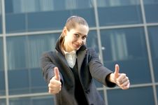 A Young Business Woman Is Holding Thumbs Up Stock Photo