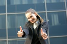 A Young Business Woman Is Holding Thumbs Up Stock Images