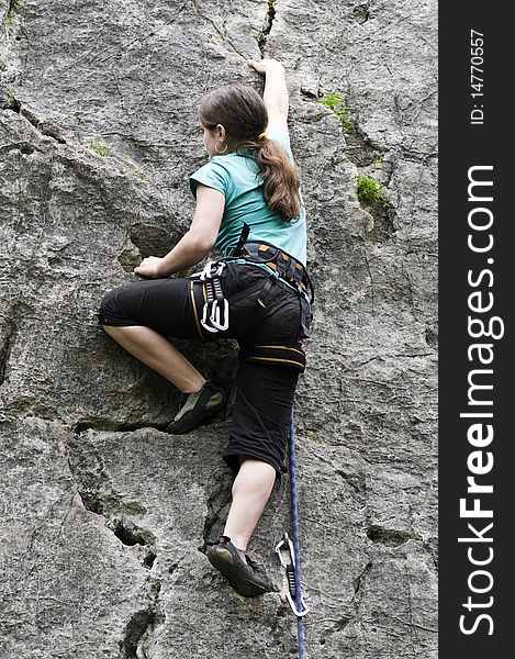 Young sportive girl in the face rock. Young sportive girl in the face rock