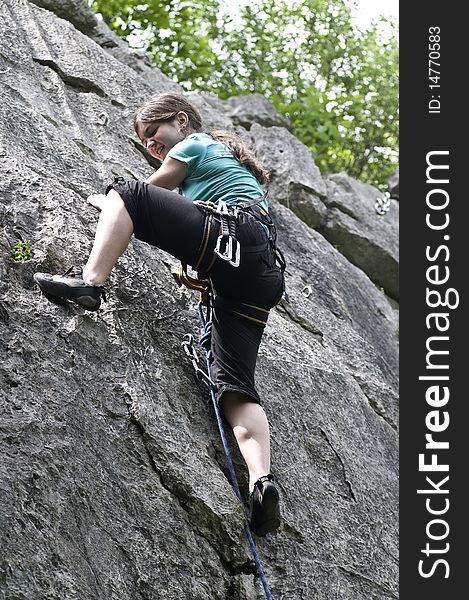 Young sportive girl in the rock face. Young sportive girl in the rock face