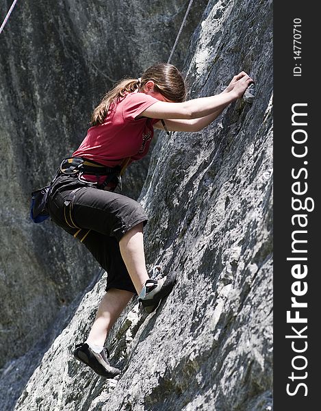 Young sportive girl in the rock face. Young sportive girl in the rock face