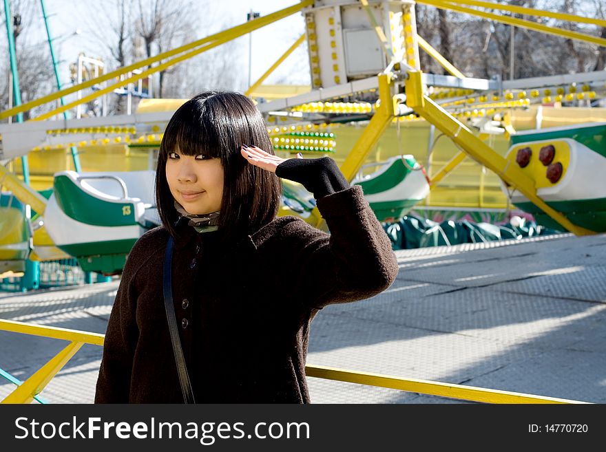 Funny girl in an amusement park