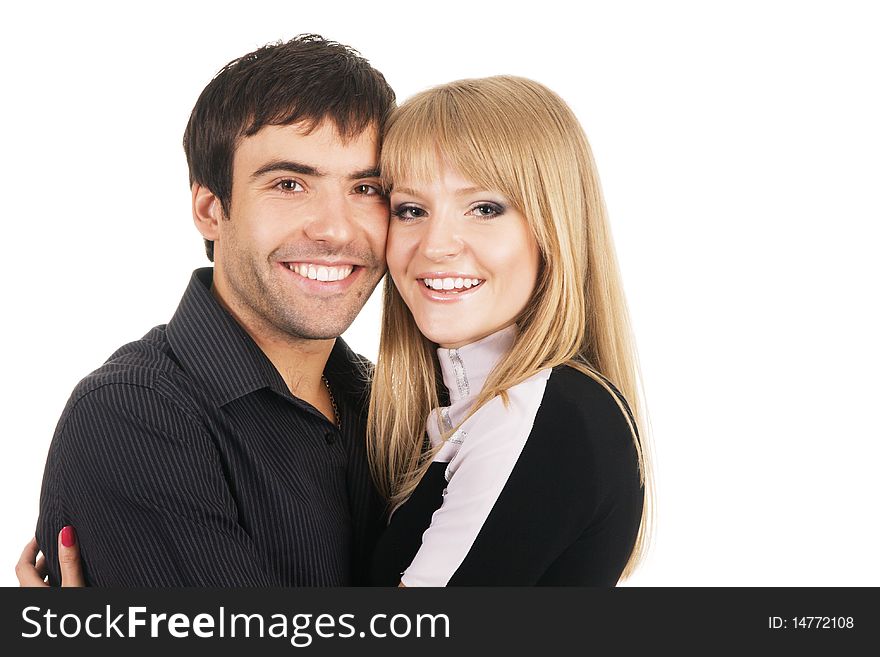 Beautiful young couple in casual clothing, white background