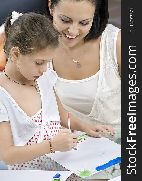 Portrait of happy mother with daughter  having good time in domestic  environment. Portrait of happy mother with daughter  having good time in domestic  environment