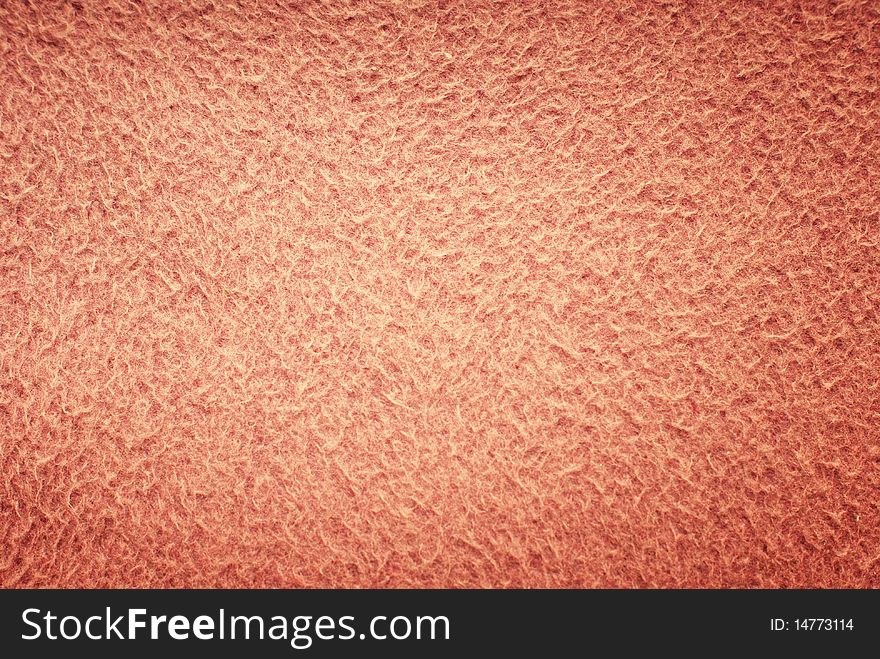 Pink background of soft fluffy material texture with effect of dark vignette. Pink background of soft fluffy material texture with effect of dark vignette