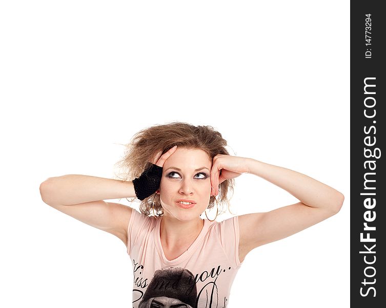 Young fashion model with her hands at her head. Isolated over white.