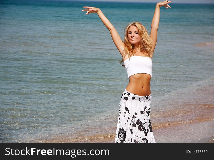 Young Beautiful Woman On Sea Background