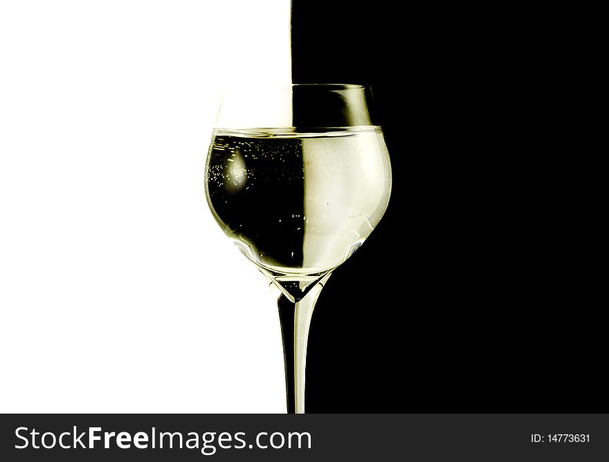 Two glasses with water, black and white background.