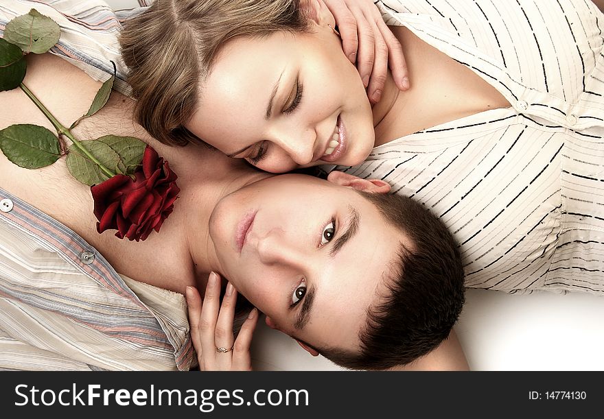 Beautiful young couple with rose. Beautiful young couple with rose