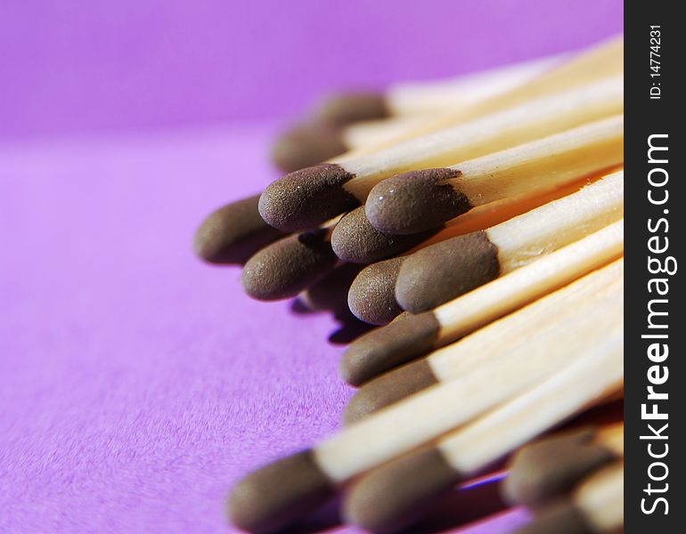 Some matches on a purple backgound. Some matches on a purple backgound