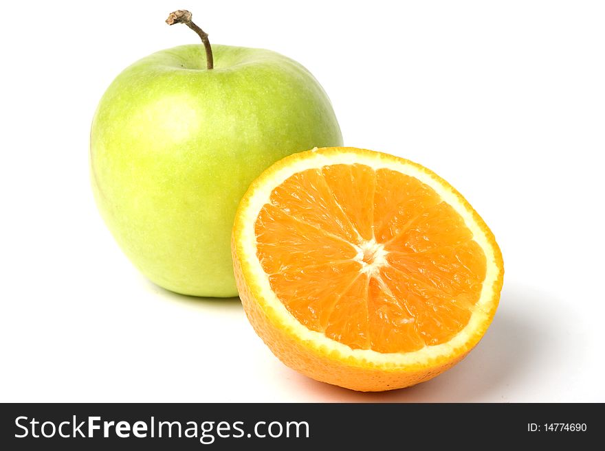 Green apple and half of orange. W. clipping path