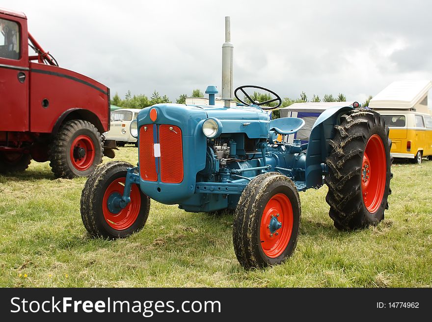 Old coloroul tractor on the grass. Old coloroul tractor on the grass