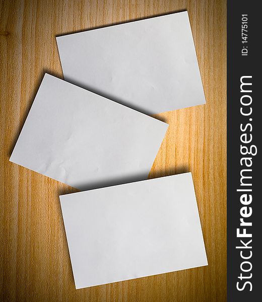 Three blank paper on wood wall with shadow. Three blank paper on wood wall with shadow