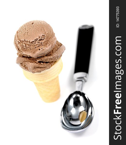 Chocolate icecream in an icecream cone isolated against a white background