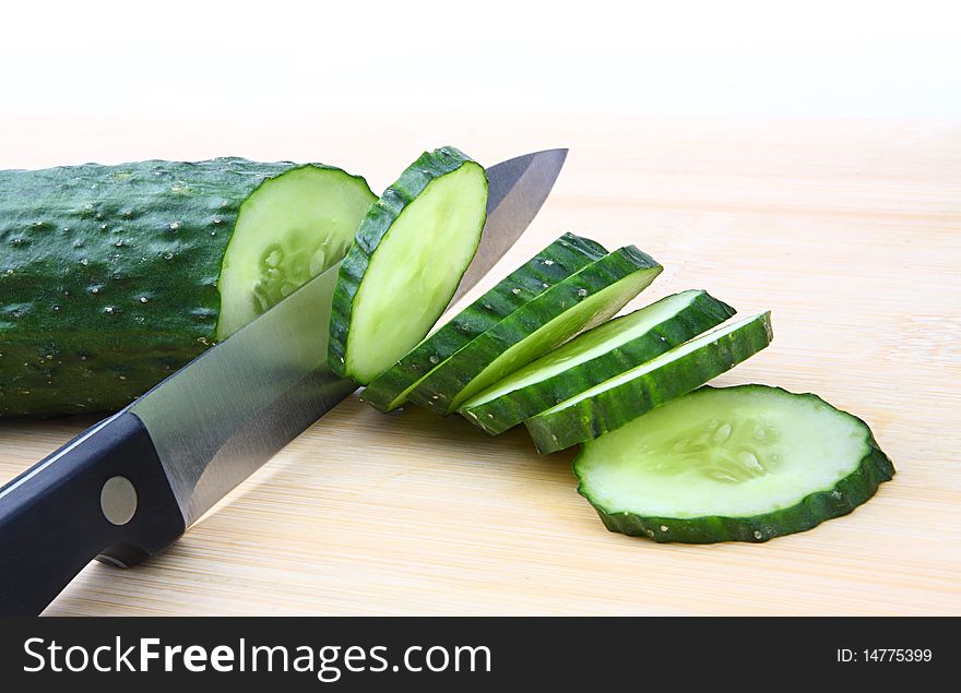 Cut the cucumber with knife. Cut the cucumber with knife