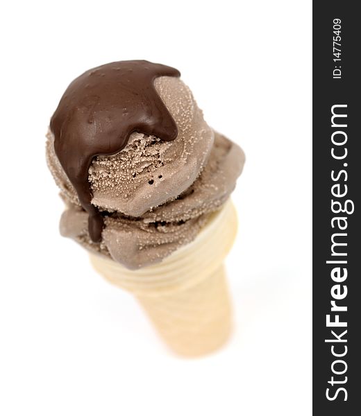 Chocolate icecream in an icecream cone isolated against a white background