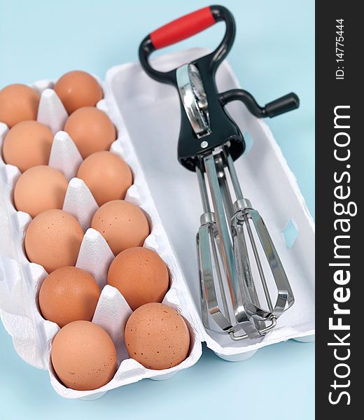 An egg beater on a kitchen bench