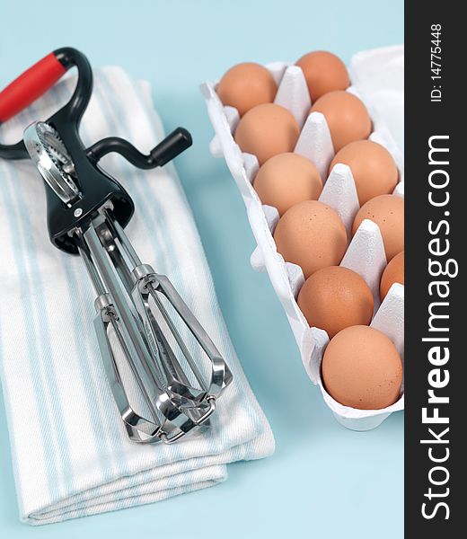 An egg beater on a kitchen bench