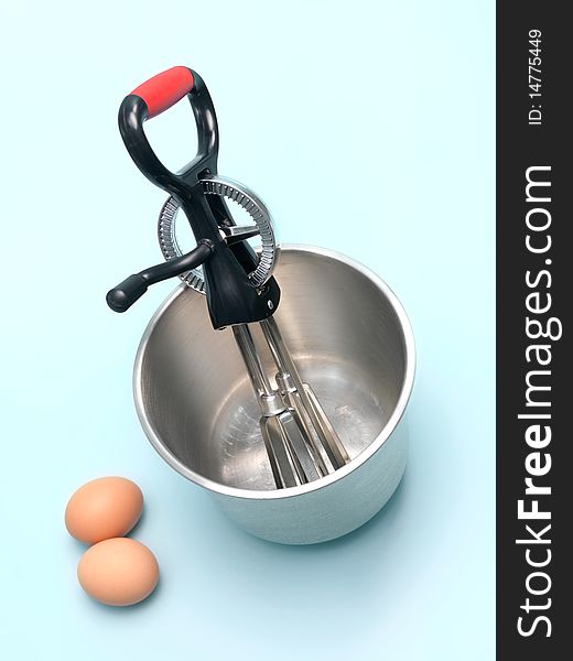 An egg beater on a kitchen bench