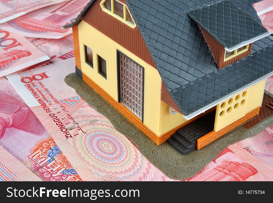 A house model is putting on a lot of money notes, means house being regarded as fortune, investment, and real estate business. A house model is putting on a lot of money notes, means house being regarded as fortune, investment, and real estate business.